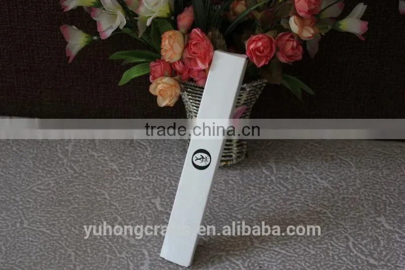 White paper box used for holding ladies fan