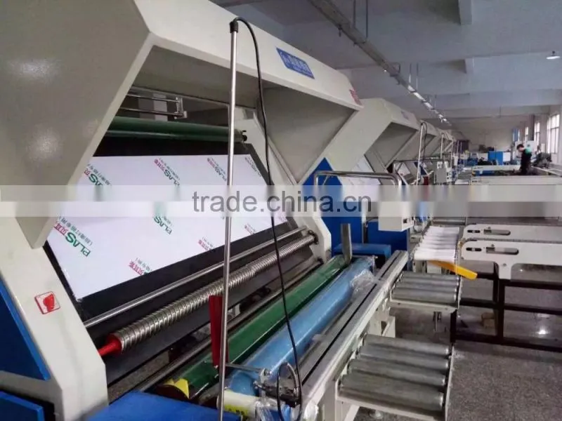 VERTICAL FABRIC-CUTTING MACHINE