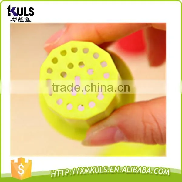 Small plastic tool for mashing garlic
