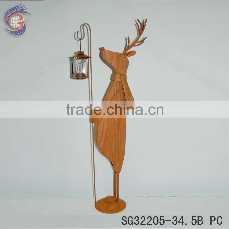 Outdoor decorations of rusty metal elk holding lantern for decorate christmas ornaments