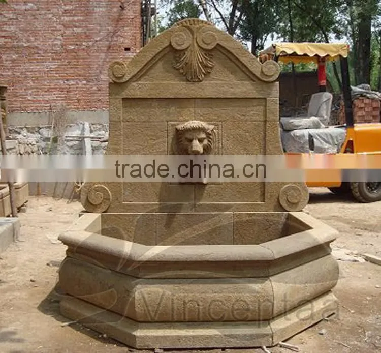 Marble lion head wall fountain