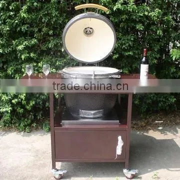 Holland Clay charcoal egg bbq grill with brown iron table