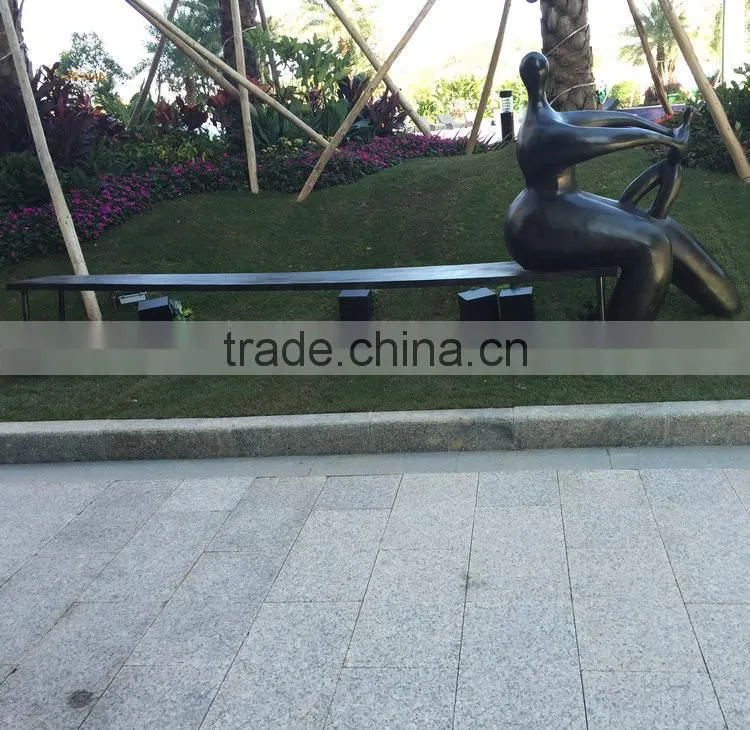 Fiberglass man character on bench