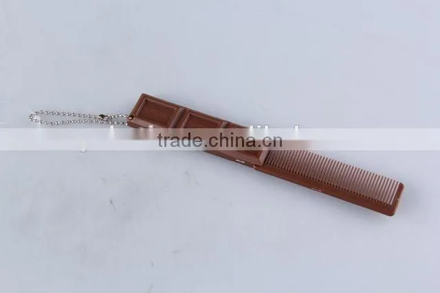 Chocolate shaped hair brush with hanging chain/folding comb