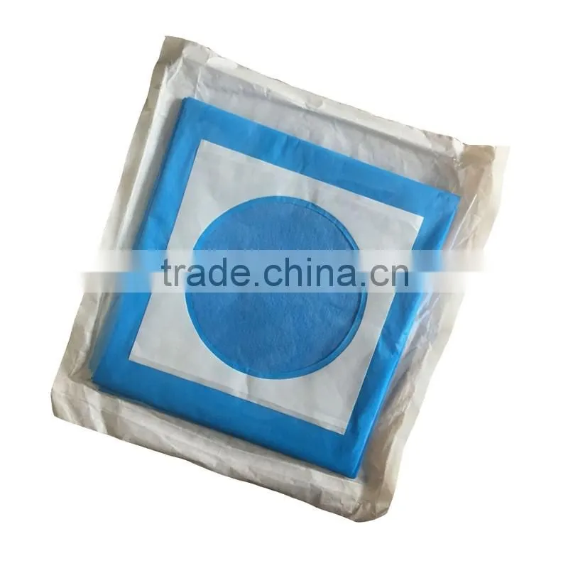 Disposable surgical drape with hole