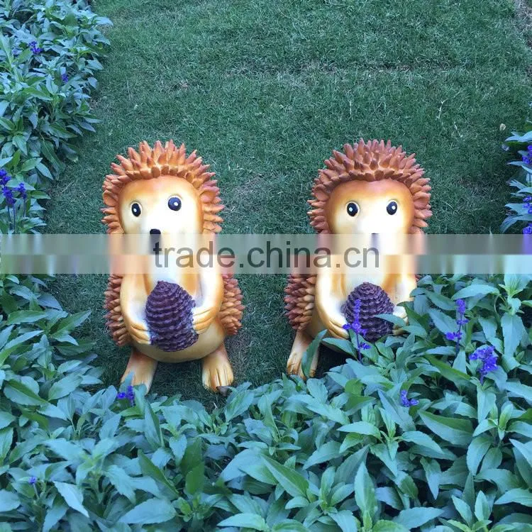 Polyresin squirrel figure in garden