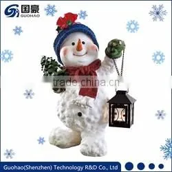 Regal Santa statue and Sledding Santa Figurine