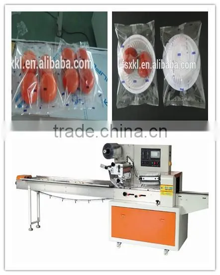 Tomatoes in tray flow packaging machine