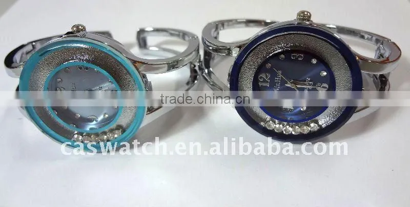 ladies' bangle watch with floating diamonds