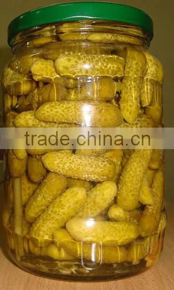 Pickled gherkin in glass jar packed in tray