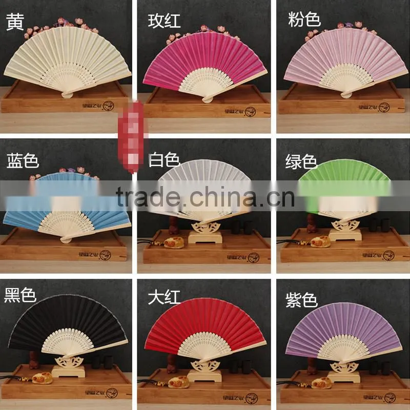 Factory direct bamboo hand fan wedding gift cloth folding hand fan in plain color