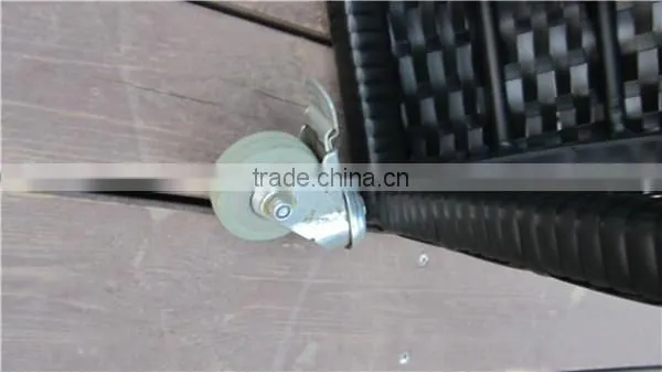 Twisted shaped rattan shower with a pulley system