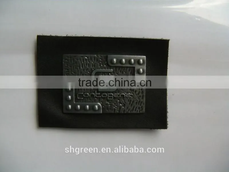 Embossed leather patch with metal logo for lady's handbag