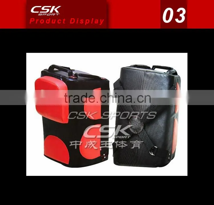 Coach training boxing punching pad