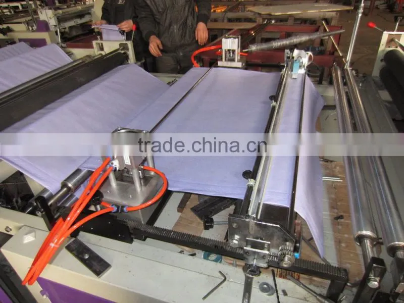 Computer Non woven roll embossed - punched - sheets cutting machine