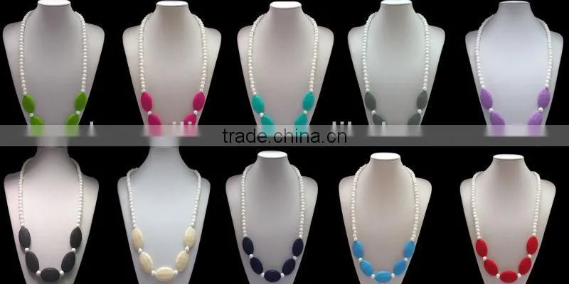 Turqoise silicone teething necklace for mom to wear and baby to enjoy