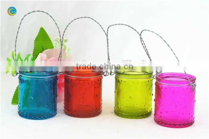 decorative wall hanging jar candle holder with black metal wiring cross pattern