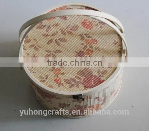 Round bamboo storage basket with flower