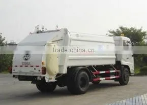 Rotating blade compression garbage truck