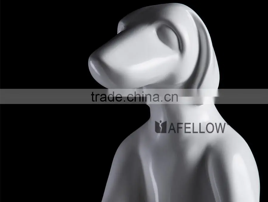 attractive window display sitting dog mannequins
