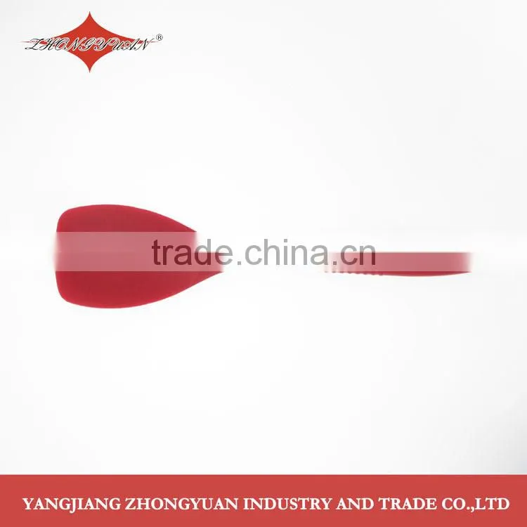 2014 New design midlle size silicone solid spoon with anti-slip soft handle