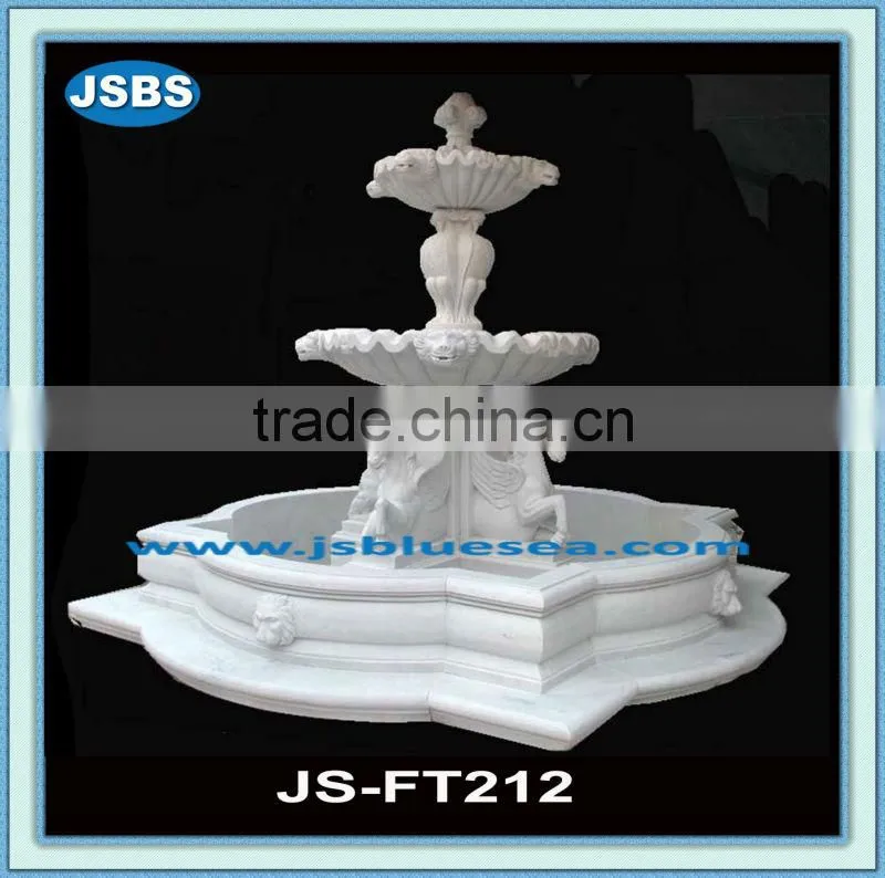 large stone outdoor water fountain with horse