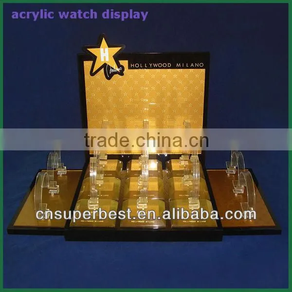 Golden acrylic watch display with C rings