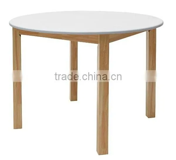 white solid wooden round dining table