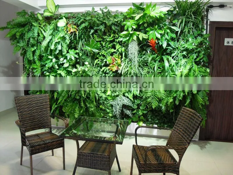 green wall with leaves/flowers/grass for decor