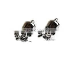 Stainless Steel Cuff links-skull head with black inlay eyes, mouth is holding a rose.