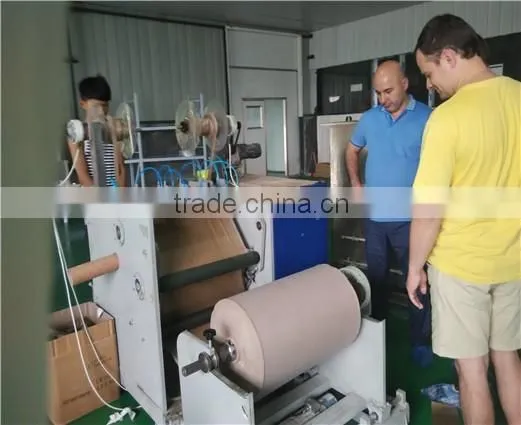 Jumbo roll slitting/adhesive tape cutting machine