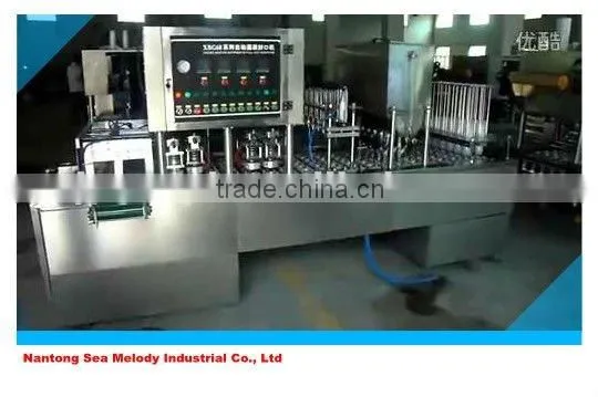 Curd cup sealing machine