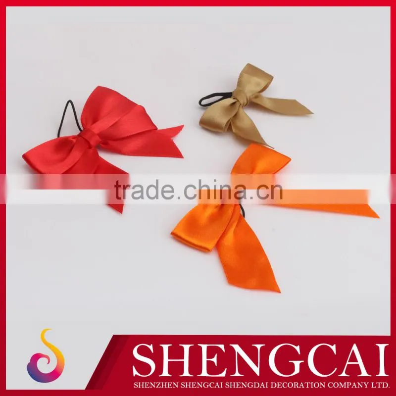 Red ribbon bow with elastic loop