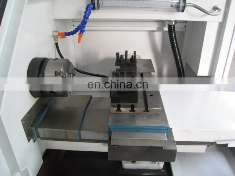 The small cnc lathe machine with chuck and tool turret CK0640A