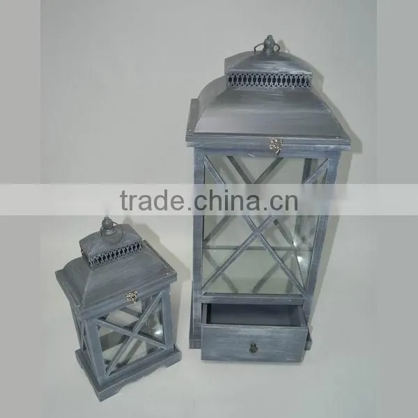 Brown wooden candle lantern with drawers