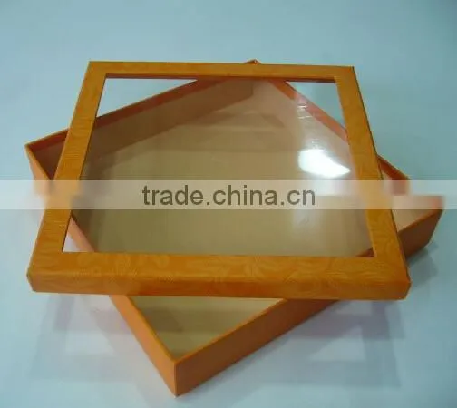 Red coloured packing box with clear window