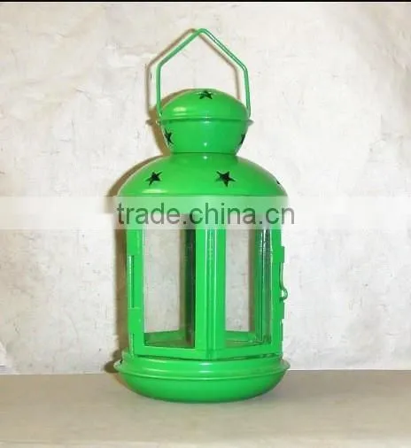 green metal lantern with clear glass wall