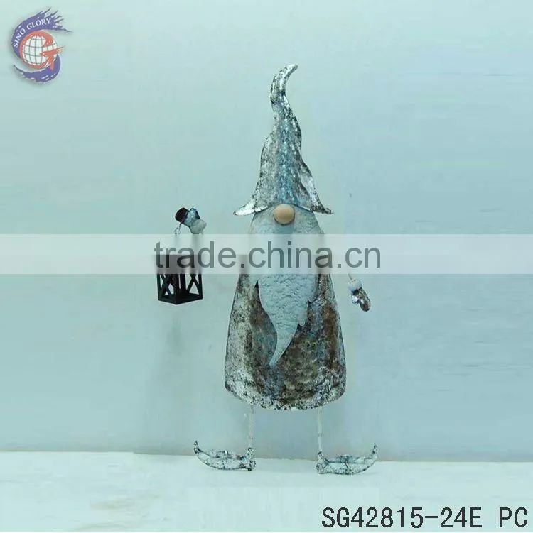 rusty metal garden gnome with lantern