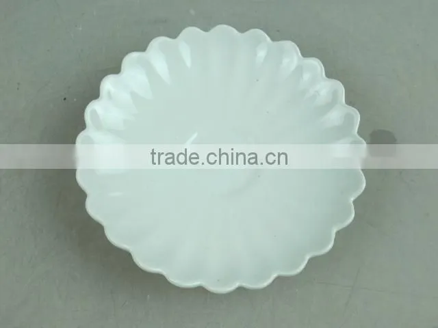 white porcelain flower-shaped dish