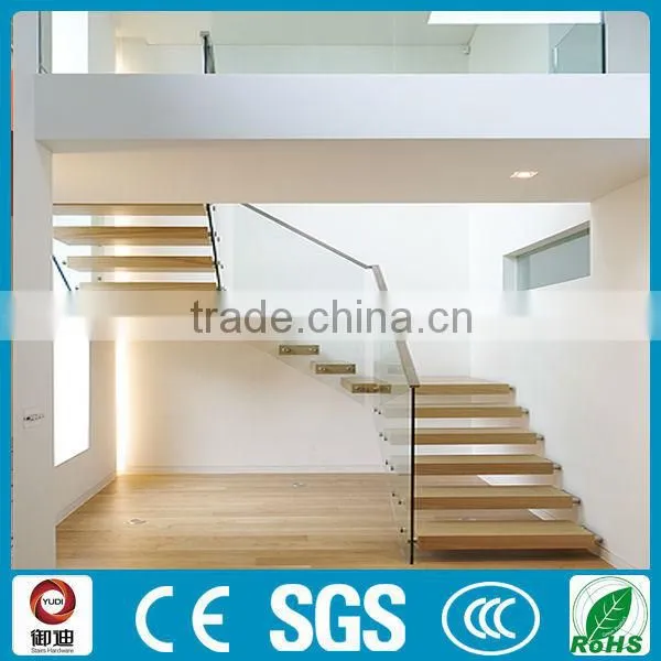 fabulous floating staircase with thick glass railing.