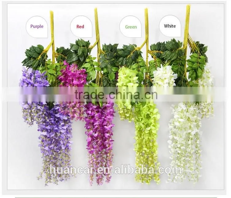 Colorful natural looking artificial flowers wisteria