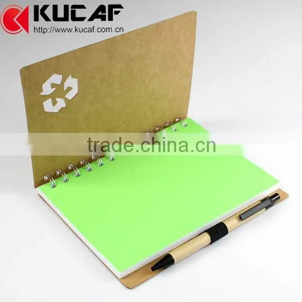 spiral paper notebook with color pages an pen