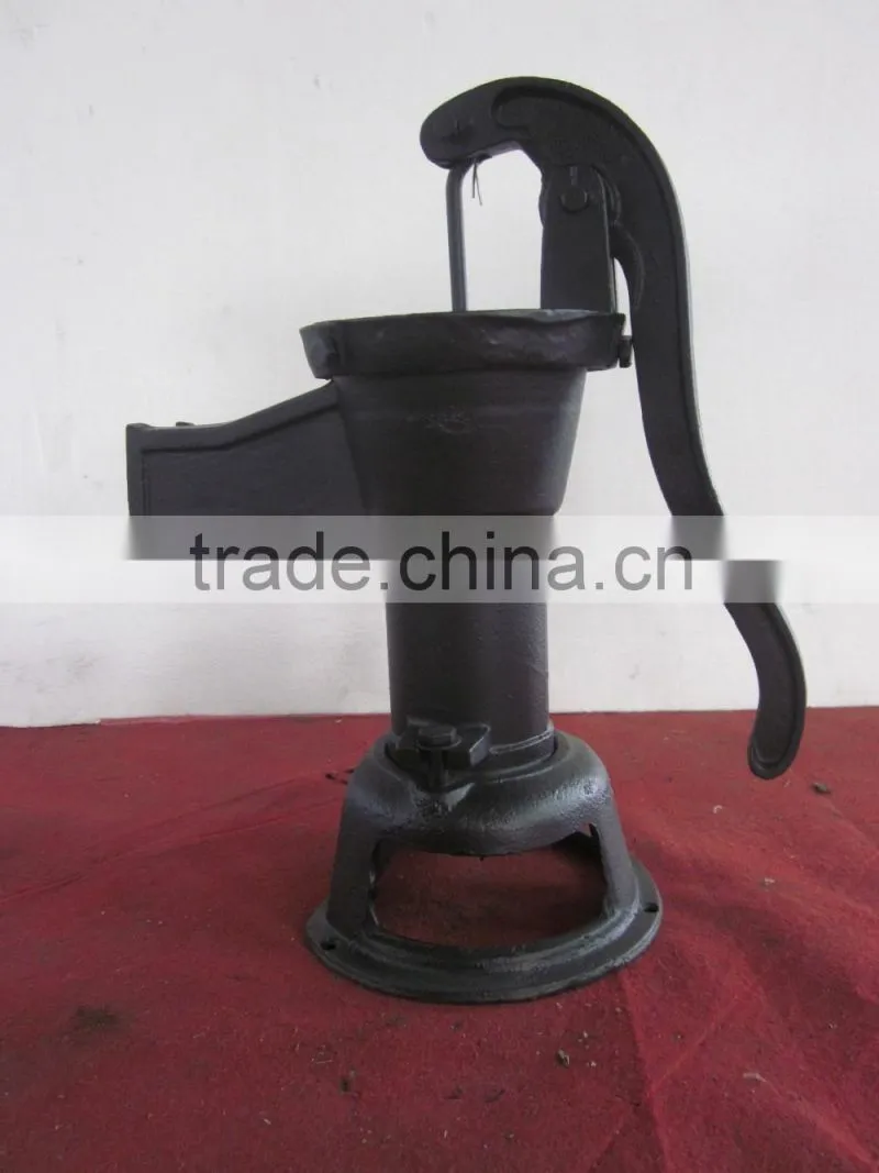 cast iron hand pump garden villiage using