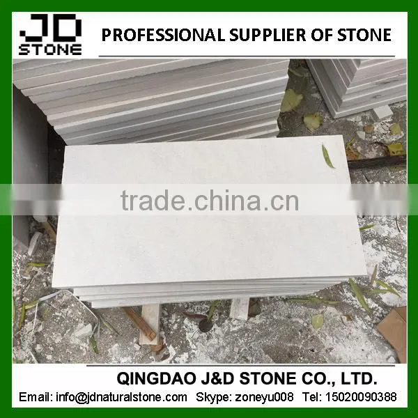 bush-hammered white sandstone paver