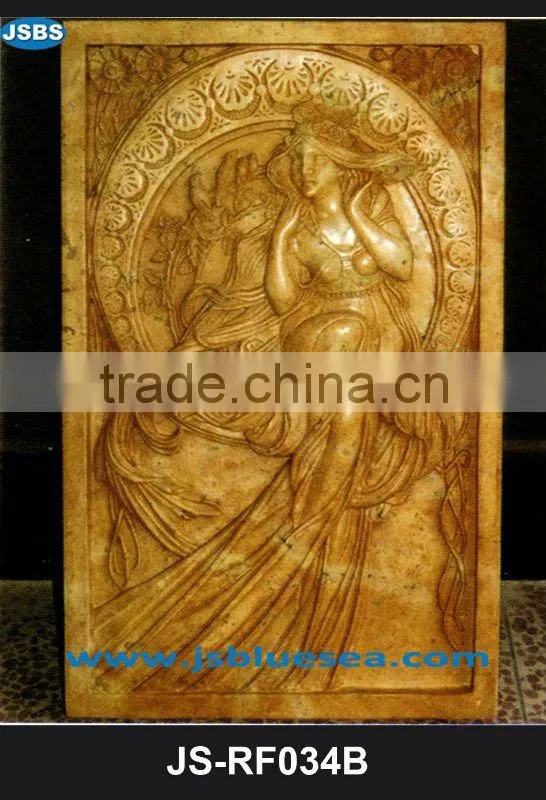 Stone carving of flower wall relief