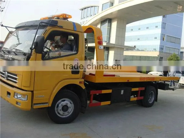 small flatbed towing truck