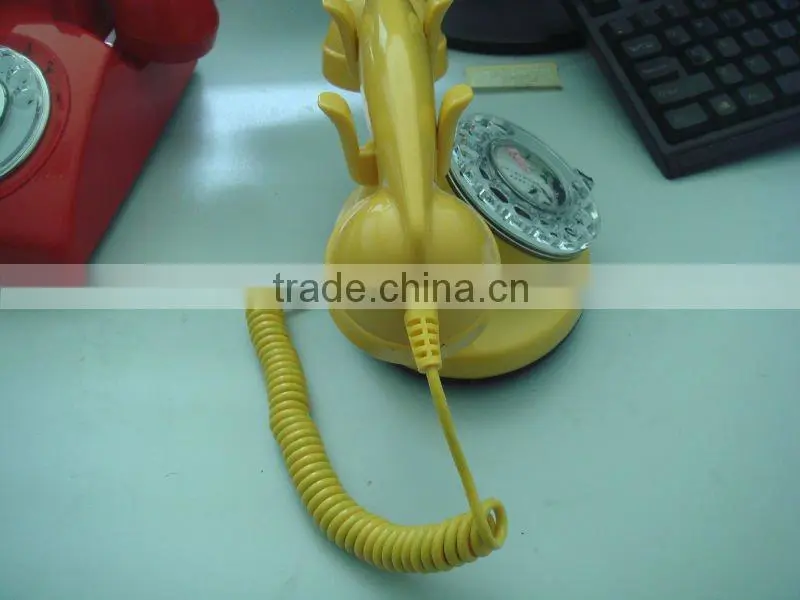 Yellow Rotary dial telephone