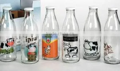 Glass baby bottle with red cap