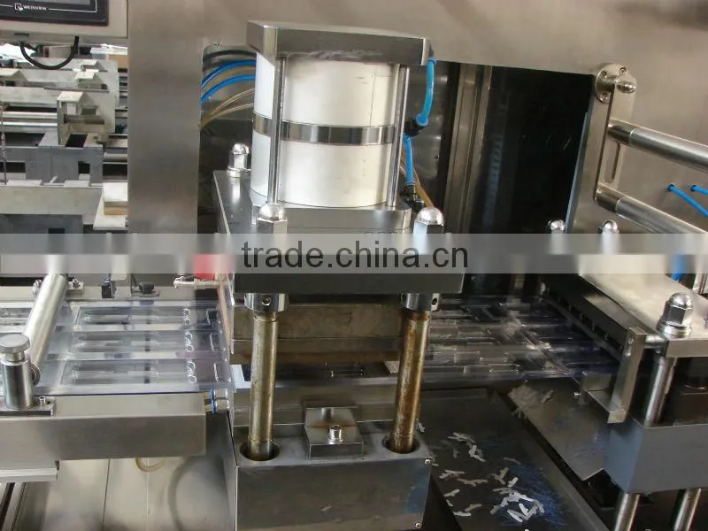 Automatic blister paper card filling and sealing machine for battery/toothbrush/etc