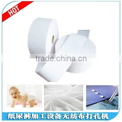 Double location for the cutting and rewinding non-woven punching machine